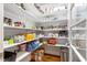 Walk-in pantry featuring built-in shelving to maximize storage space and organization at 3650 Brooks Bnd, Franklinton, NC 27525
