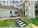 Outdoor patio with dining and seating areas, perfect for entertaining guests at 3838 Regent Rd, Durham, NC 27707