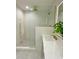 A modern bathroom with double vanity, decorative mirror, and tile shower at 3838 Regent Rd, Durham, NC 27707
