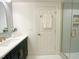 Bright bathroom with modern fixtures, white subway tile, and glass enclosed shower with gold trim at 3838 Regent Rd, Durham, NC 27707
