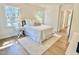 Well lit bedroom with large windows, hardwood floors, and stylish decor at 3838 Regent Rd, Durham, NC 27707