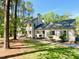 Attractive two-story home with shutters, set amidst a wooded landscape at 3838 Regent Rd, Durham, NC 27707
