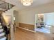 The foyer features an open floor plan and a view into the kitchen and dining room at 3838 Regent Rd, Durham, NC 27707