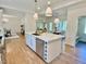 Spacious kitchen features a large island, modern appliances, and ample counter space at 3838 Regent Rd, Durham, NC 27707
