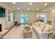 Cozy living room with fireplace, built-ins, and french doors to the backyard at 3838 Regent Rd, Durham, NC 27707