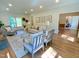 Warm living room featuring hardwood floors, a comfortable seating area, and plenty of natural light at 3838 Regent Rd, Durham, NC 27707