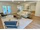 Inviting living room with a plush sofa, stylish decor, and French doors to the exterior at 3838 Regent Rd, Durham, NC 27707
