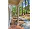 View from the porch with classic white column and manicured landscaping at 3838 Regent Rd, Durham, NC 27707