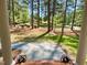 Inviting front porch with landscaped views and elegant columns at 3838 Regent Rd, Durham, NC 27707