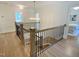 Beautiful staircase with wood floors, black metal railings, and chandelier at 3838 Regent Rd, Durham, NC 27707