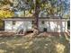 Exterior back view of home featuring a deck and large backyard at 3907 Inwood Dr, Durham, NC 27705