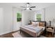 Cozy bedroom with hardwood floors, neutral decor, and bright natural light at 3907 Inwood Dr, Durham, NC 27705