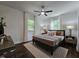 Cozy bedroom with neutral decor, soft lighting, and hardwood floors at 3907 Inwood Dr, Durham, NC 27705