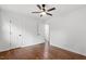 This bedroom has hardwood floors, white walls, ceiling fan, and two doors at 3907 Inwood Dr, Durham, NC 27705