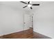 Cozy bedroom featuring hardwood floors, neutral walls, and a ceiling fan at 3907 Inwood Dr, Durham, NC 27705
