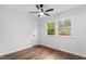 Natural light streams through the two windows of this carpet-less bedroom at 3907 Inwood Dr, Durham, NC 27705