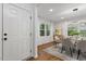 Bright dining room features hardwood floors, modern lighting, and a table set for a delightful dining experience at 3907 Inwood Dr, Durham, NC 27705