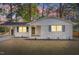 Charming single-story home featuring painted brick, modern fixtures, covered parking, and a well-maintained front yard at 3907 Inwood Dr, Durham, NC 27705