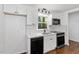 Well-lit kitchen with stainless steel appliances and white subway tile backsplash at 3907 Inwood Dr, Durham, NC 27705