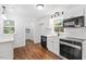 Charming kitchen featuring stainless steel appliances and window with natural light at 3907 Inwood Dr, Durham, NC 27705