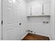 Laundry room with white cabinets, utility sink, and washer/dryer hookups at 3907 Inwood Dr, Durham, NC 27705