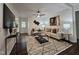 Comfortable living room featuring neutral tones, stylish decor, and a cozy rug at 3907 Inwood Dr, Durham, NC 27705