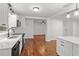 Sun-filled open-concept living room with newly refinished hardwood floors at 3907 Inwood Dr, Durham, NC 27705