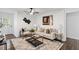 Cozy living room with neutral decor, comfortable seating, stylish rug, and modern artwork for a welcoming atmosphere at 3907 Inwood Dr, Durham, NC 27705