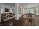 Open concept living and dining area with hardwood floors and plenty of natural light at 3907 Inwood Dr, Durham, NC 27705