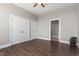 Neutral-toned bedroom featuring wood floors, double closets, and an ensuite bathroom at 400 W North St # 1430, Raleigh, NC 27603