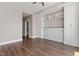 Bedroom featuring hardwood floors, built in shelves and cabinets with drawers at 400 W North St # 1430, Raleigh, NC 27603