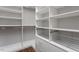 Spacious walk-in closet with custom shelving and drawers, offering ample storage space at 400 W North St # 1430, Raleigh, NC 27603