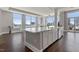 Bright modern kitchen with large island, marble countertops, and floor-to-ceiling windows at 400 W North St # 1430, Raleigh, NC 27603