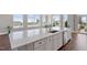Kitchen island featuring quartz countertops, sink, and stainless steel dishwasher at 400 W North St # 1430, Raleigh, NC 27603