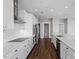 Well-appointed kitchen with stainless steel appliances, marble countertops and backsplash, and dark wood flooring at 400 W North St # 1430, Raleigh, NC 27603