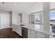 Modern kitchen with a large island, stone counters, and stainless steel appliances at 400 W North St # 1430, Raleigh, NC 27603
