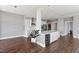 Modern kitchen features white cabinets, marble countertops, and a large island with a built-in beverage cooler at 400 W North St # 1430, Raleigh, NC 27603