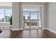 Bright and open living area with floor-to-ceiling windows and hardwood floors at 400 W North St # 1430, Raleigh, NC 27603
