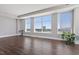 Bright living room with large windows offering city views and stylish wood flooring at 400 W North St # 1430, Raleigh, NC 27603
