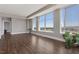 Spacious living room featuring gleaming hardwood floors and bright windows at 400 W North St # 1430, Raleigh, NC 27603