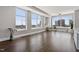 Open-concept living area with large windows and beautiful flooring and decor at 400 W North St # 1430, Raleigh, NC 27603