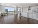 Living area with open layout featuring large windows, stylish decor and modern kitchen at 400 W North St # 1430, Raleigh, NC 27603