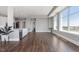 Expansive living room featuring hardwood floors, tall ceilings, and a modern kitchen at 400 W North St # 1430, Raleigh, NC 27603