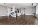Open-concept living space with kitchen island and hardwood floors at 400 W North St # 1430, Raleigh, NC 27603