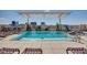 Relaxing rooftop pool area with lounge chairs and city views at 400 W North St # 1430, Raleigh, NC 27603