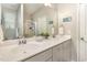 Bright bathroom with double sinks, a large mirror, and a glass-enclosed shower at 420 Cherry St, Fuquay Varina, NC 27526