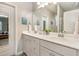 Bright bathroom featuring double sinks, ample counter space, modern fixtures, and a clean design, offering convenience and style at 420 Cherry St, Fuquay Varina, NC 27526