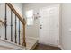 Bright entryway with staircase, white front door, and stylish decor at 420 Cherry St, Fuquay Varina, NC 27526