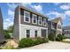 Beautiful two-story home featuring a modern exterior design with a well-manicured front yard at 420 Cherry St, Fuquay Varina, NC 27526