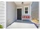 Welcoming front porch with stylish bench seating and decorative pillows at 420 Cherry St, Fuquay Varina, NC 27526